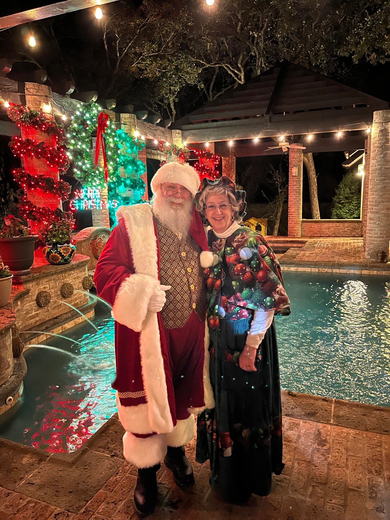 Santa Claus by poolside holiday lights